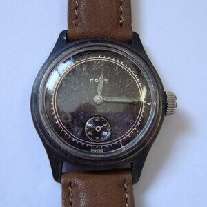 VINTAGE WIND UP MILITARY CORT ,STERLING BEZEL ,RUN GREAT